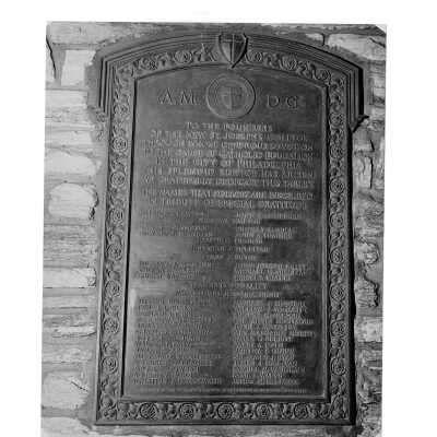 Plaque on stone wall of Barbelin Hall honoring the founders and donors of new Saint Joseph's College.