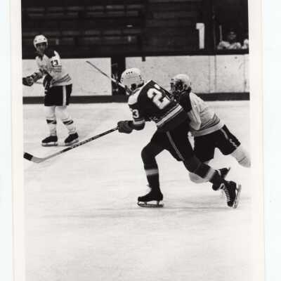 Men's ice hockey team in game.