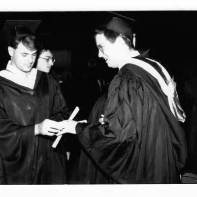 Views of small groups of graduates after receiving their diplomas.