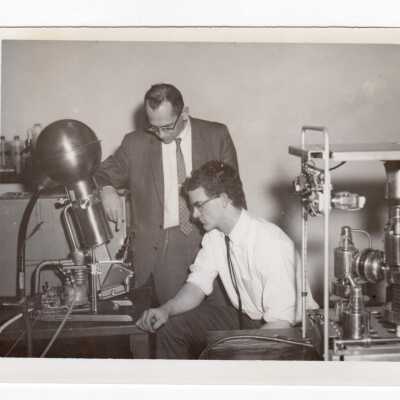 Physics professor, Dr. Shapiro, working with student, Francis Snedeker, in laboratory, c. 1965.