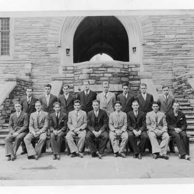 Members of Junior Week student committee seated in Barbelin Quadrangle.