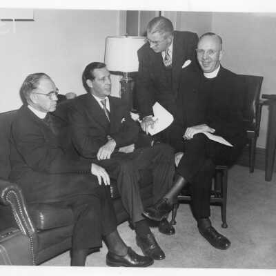 Edward G. Jacklin, S.J, Maurice J. Tobin, U.S. Secretary of Labor, Leo C. Brown, S.J, and James Hayes talking during labor symposium on industrial relations held October 26, 1951 in Flanigan Auditorium during centennial celebration.