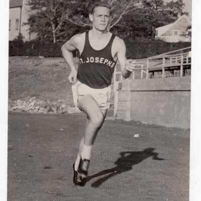 Track team member running.