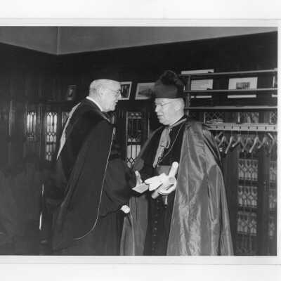 Bishop Thomas Feeney, S.J., and John Foster Dulles, in Greaton Room in Barbelin Hall after academic convocation, October 28, 1951, as part of centennial celebration.