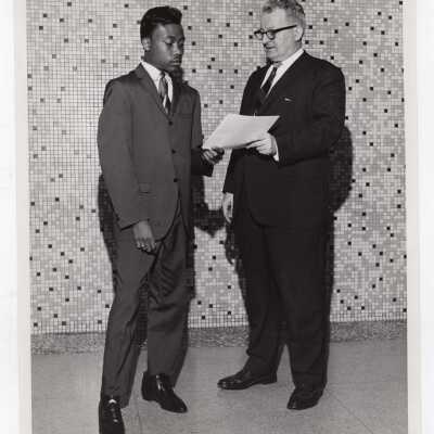 George Beichl awarding certificate of merit to a high school student for participating in Chemistry Department's Science Motivation Program, spring 1968.