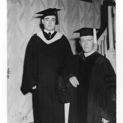 Graduating student Thomas Lewis with his father John F. Lewis, M.D., Class 1908 during 1950 graduation/commencement ceremony.