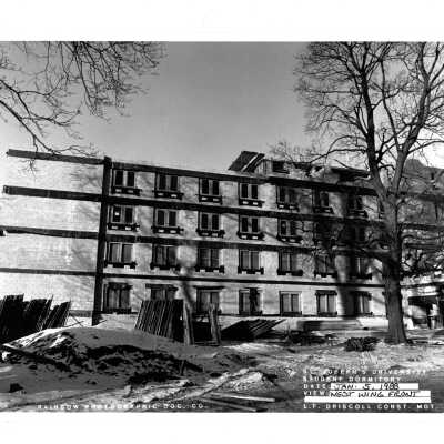 View of McShain Hall construction with snow on ground.