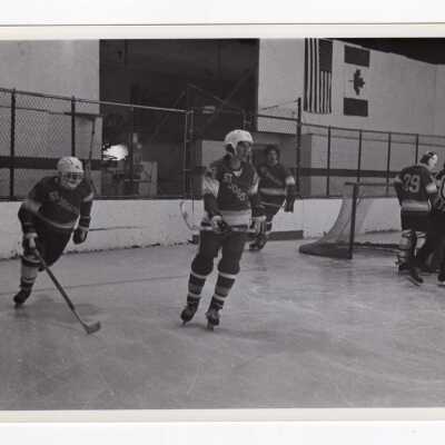Men's ice hockey team in game.