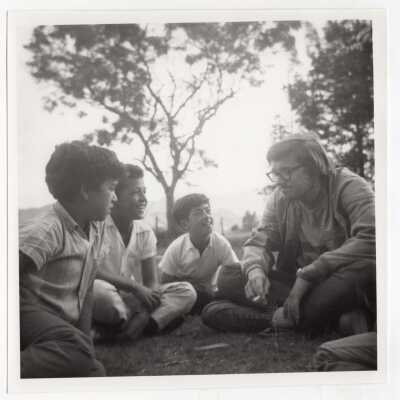 SJC student, Frank Pedrotty, with three children in Aguas Claras, Colombia, during Latin American Studies Institute Summer Service Project, summer 1970.