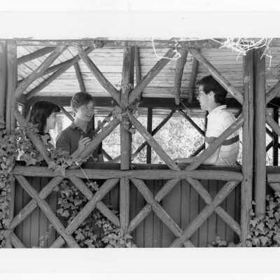 Students talking in old gazebo of Boland Hall.