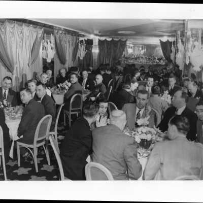 View of alumni association dinner honoring John J. Sullivan (?) at Barclay Hotel, January 17, 1950, with John Sullivan, W. Coleman Nevils, Cornelius O'Brien, Judge Vincent Carroll, Thomas Galbally (?), Joseph Hogan, S.J.