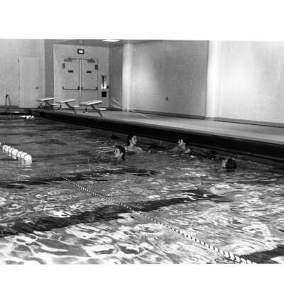 Women swimming in pool in Sports Complex.