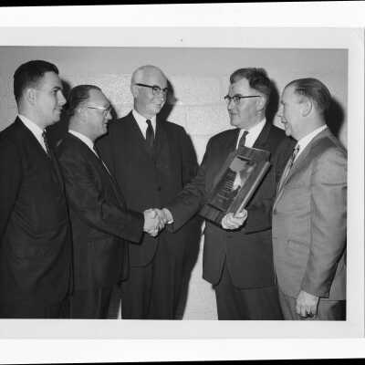 Albert G. Metz, Jr., receiving Hogan Alumni Award, March 3, 1965.