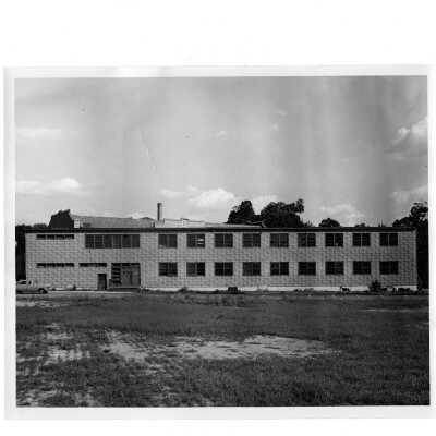Exterior rear view of veterans barracks located near Cardboard College (also known as Barbelin Annex).