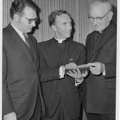 Rabbi Marc Tanenbaum, Terrence Toland, S.J., and Cardinal John Krol examining ancient book during Third Institute on Catholic -Jewish Relations, March 2, 1971.