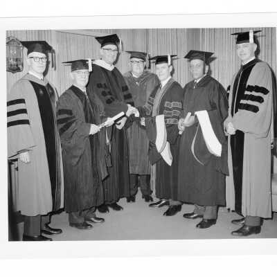 William F. Maloney, S.J., with honorary degree recipients and dignitaries, Joseph F. Burke, John A. McCormick, M.D., William F. Kellow, M.D., Lawrence W. Pierce, William Toomey, during September 1964 graduation/commencement.