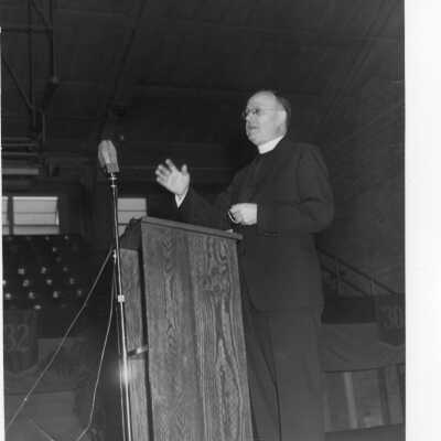 Allan Farrell, S.J., addressing symposium on Jesuit education as part of centennial celebration, October 27, 1951.