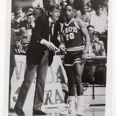 Men's Basketball player Dave Slattery with Coach during game