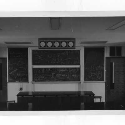 View of classroom and blackboards in science center.