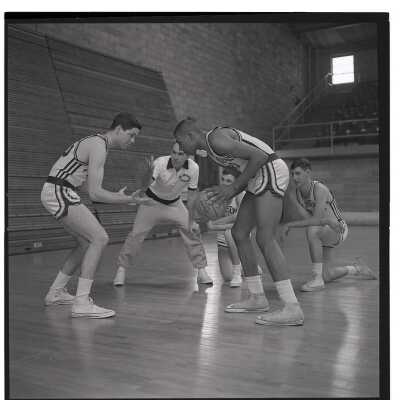Basketball coach, Jack Ramsey, with his players.