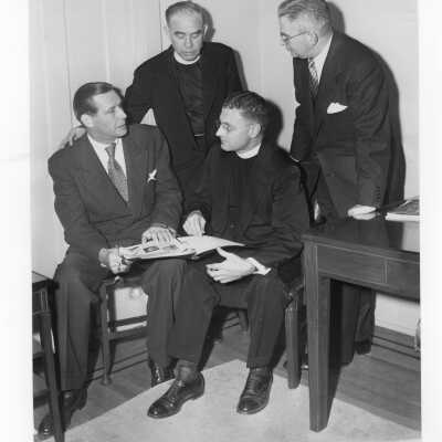 Edward G. Jacklin, S.J, Maurice J. Tobin, U.S. Secretary of Labor, Leo C. Brown, S.J, and James Hayes talking during labor symposium on industrial relations held October 26, 1951 in Flanigan Auditorium during centennial celebration.