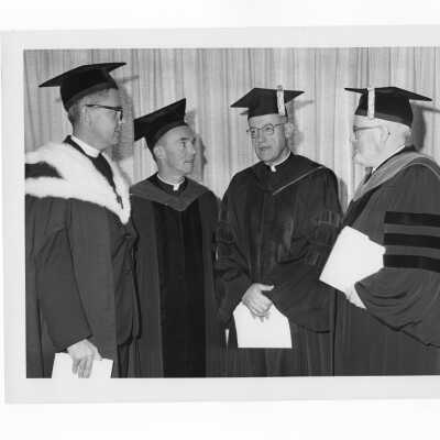 Inauguration of Terrence Toland, S.J., as president of SJC, November 14, 1968. Before ceremony, Toland meets with main speaker, Paul Reinert, S.J., Jerome Coll, S.J., and James E. Dougherty.