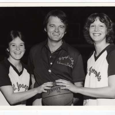 Women's Basketball Coach with two players