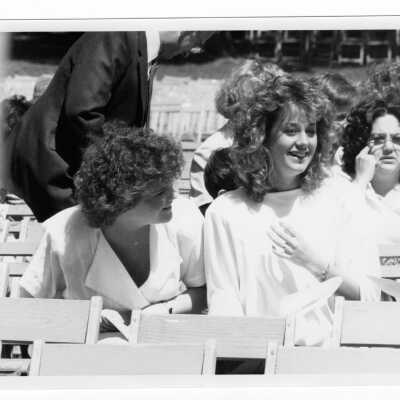 Views of students and guests at outdoor Baccalaureate service, graduation/commencement, c. 1985.