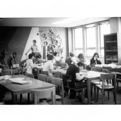 Students studying in Campbell Library, Academy of Food Marketing, Villiger (later Post) with the "Theology of Hunger" fresco in background.