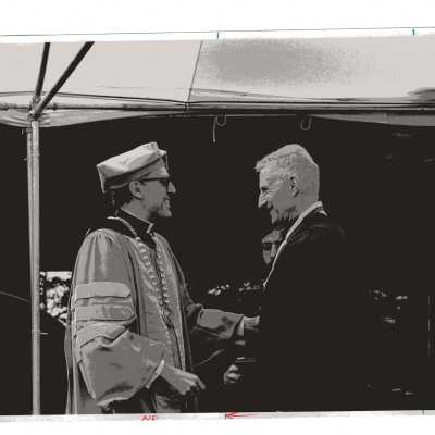 Stanley A. Bodalski receiving Bene Merenti medal from Donald I. MacLean, S.J. during 1979 graduation/commencement.