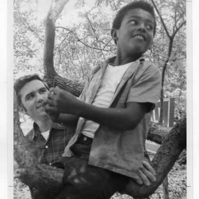 Joseph Daoust, S.J. with elementary students from 17th and Girard neighborhool in Philadelphia on SJC campus (?). This may have been part of SJC Commune outreach effort during summer 1968.