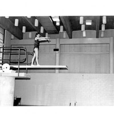 Woman diving into swimming pool in Sports Complex.