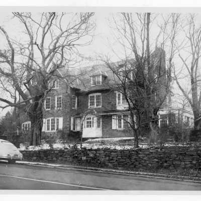 Exterior view of Greaton Hall from Cardinal Avenue with car parked on street.