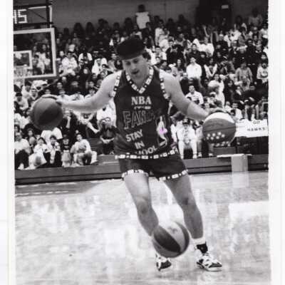 Crazy George dribbling three balls before Men's Basketball game