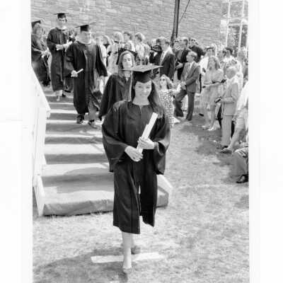 Graduates descending from stage after being awarded diplomas during 1993 graduation/commencement.