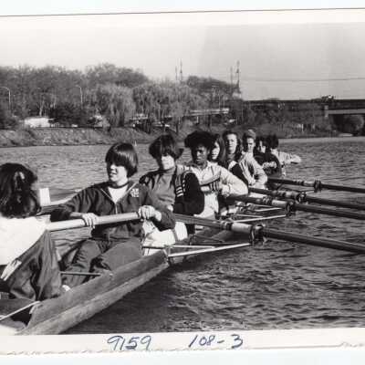 Women's crew/rowing team members practicing.