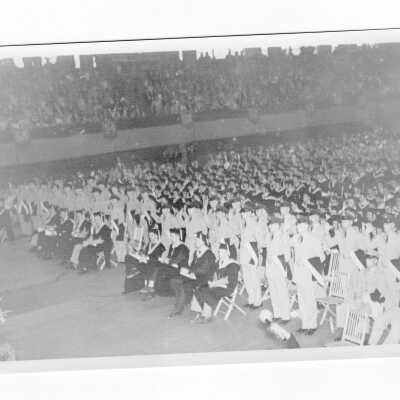 Commissioning of Air Force ROTC graduates during 1956 graduation/commencement ceremony in Field House.