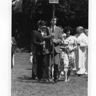 Procession of servers and concelebrants during Baccalaureate service, 1985 graduation/commencement. Also a photograph of program.