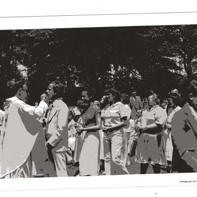 Graduates receiving communion from Donald I. MacLean, S.J., during Baccalaureate service, 1980 graduation/commencement.