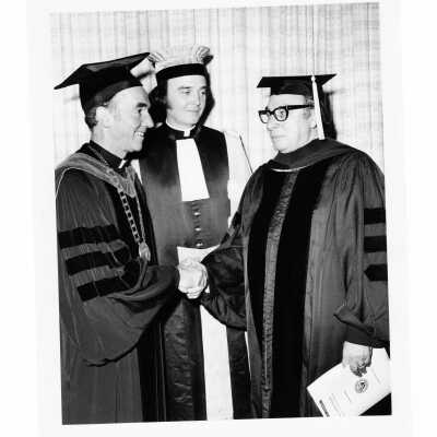 Terrence Toland, S.J., Francis F. Burch, S.J., with honorary degree recipient, Philip J. Scharper during 1975 graduation/commencement.
