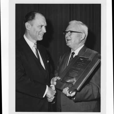 Hugh B. Flanigan, D.D.S., receiving Hogan Alumni Award, February 8, 1967.