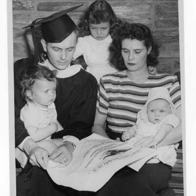 Graduating student, Joseph D. Flaherty, with his wife and three children during 1949 graduation/commencement.