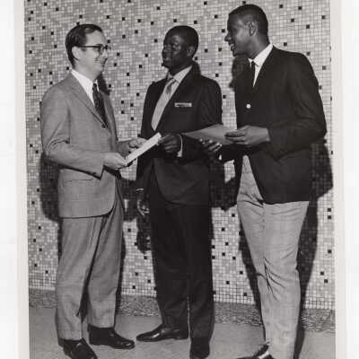 Two high school students receiving certificates of merit for participating in Chemistry Department's Science Motivation Program, spring 1968.