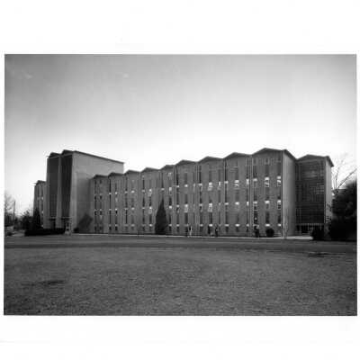 Exterior front view of Bellarmine with students walking.