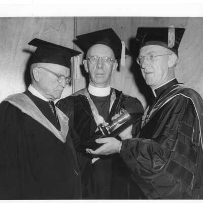 J. Joseph Bluett, S.J. and Dennis Comey, S.J. with Ignatius J. Horstmann, recipient of the Greaton Chalice at academic convocation, October 4, 1959.