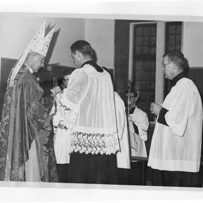 Archbishop John Krol, William F. Maloney, S.J, and others at Mass during Saint Joseph's week, March 1964.
