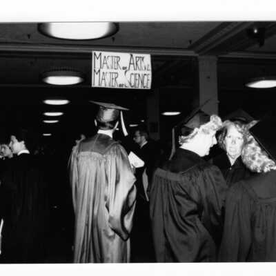 Graduating students assembling for procession to Convention Hall, Philadelphia Civic Center during 1990 graduation/commencement.