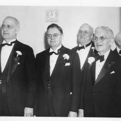 Several judges, including Judge Clare Fenerty (class of 1916) and Thomas Quirk (?) during banquet held in Field House as part of centennial anniversary celebration.