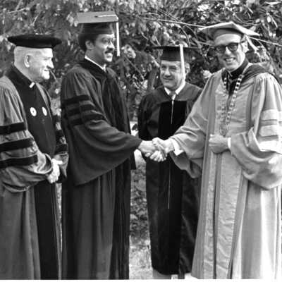 Donald I. MacLean, S.J. with honorary degree recipients, Eugene P. McCreesh, S.J. (?), U.S. Representative William H. Gray III, Joseph J. Saker (?) during 1980 graduation/commencement.