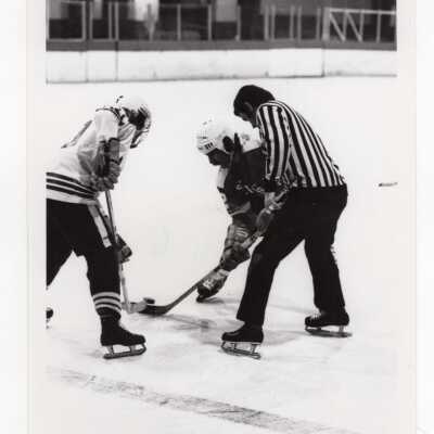 Men's ice hockey team in game.